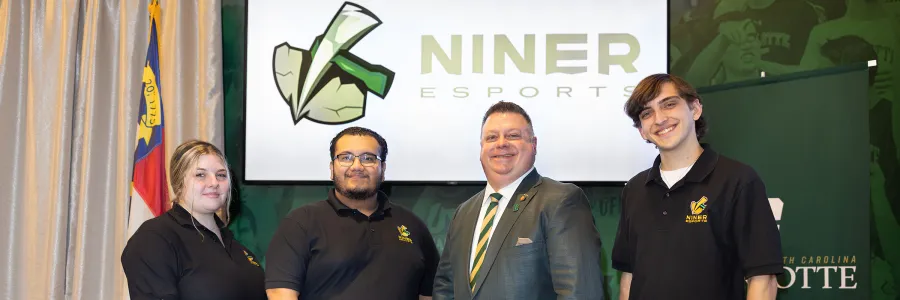 Three Niner Esports student leaders and Rep. Jason Saine ’95 are recognized for efforts in the approval of the $1.5 million state appropriation to create a dedicated esports space in Norm’s Loft in the Popp Martin Student Union.